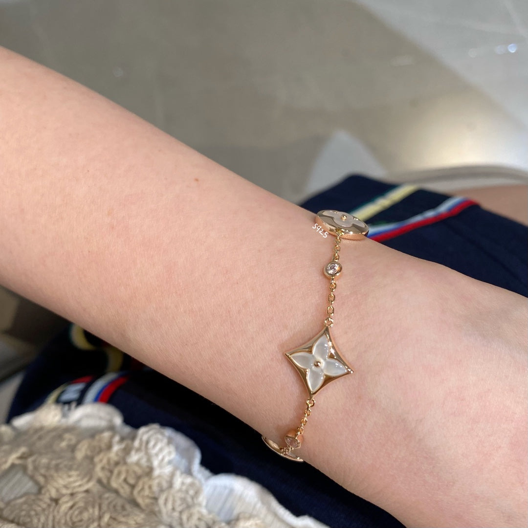 [Stellar Jewelry]STAR AND SUN 4 MOTIF WHITE MOP PINK GOLD BRACELET
